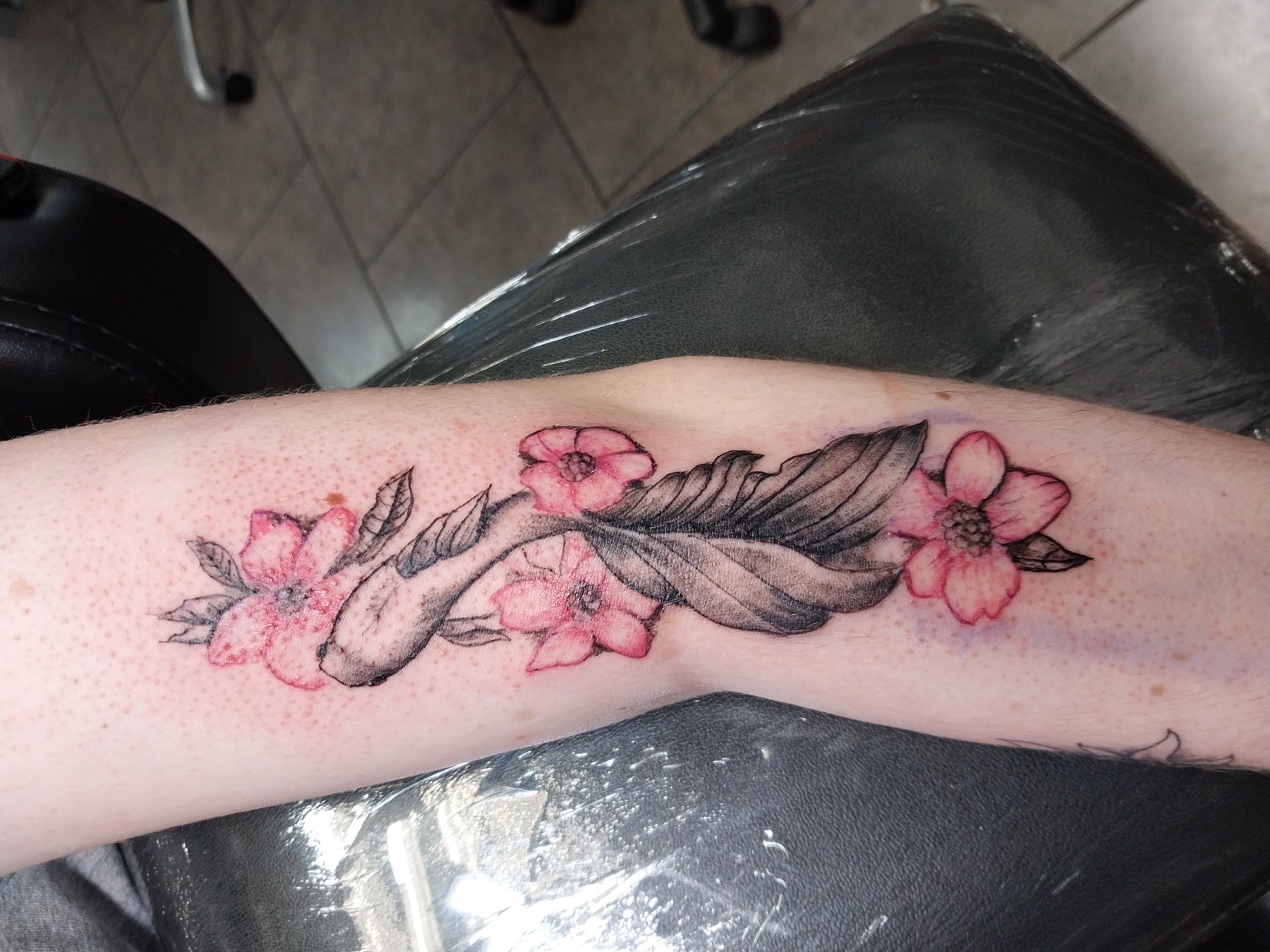Floral feather tattoo by Tony Parisi