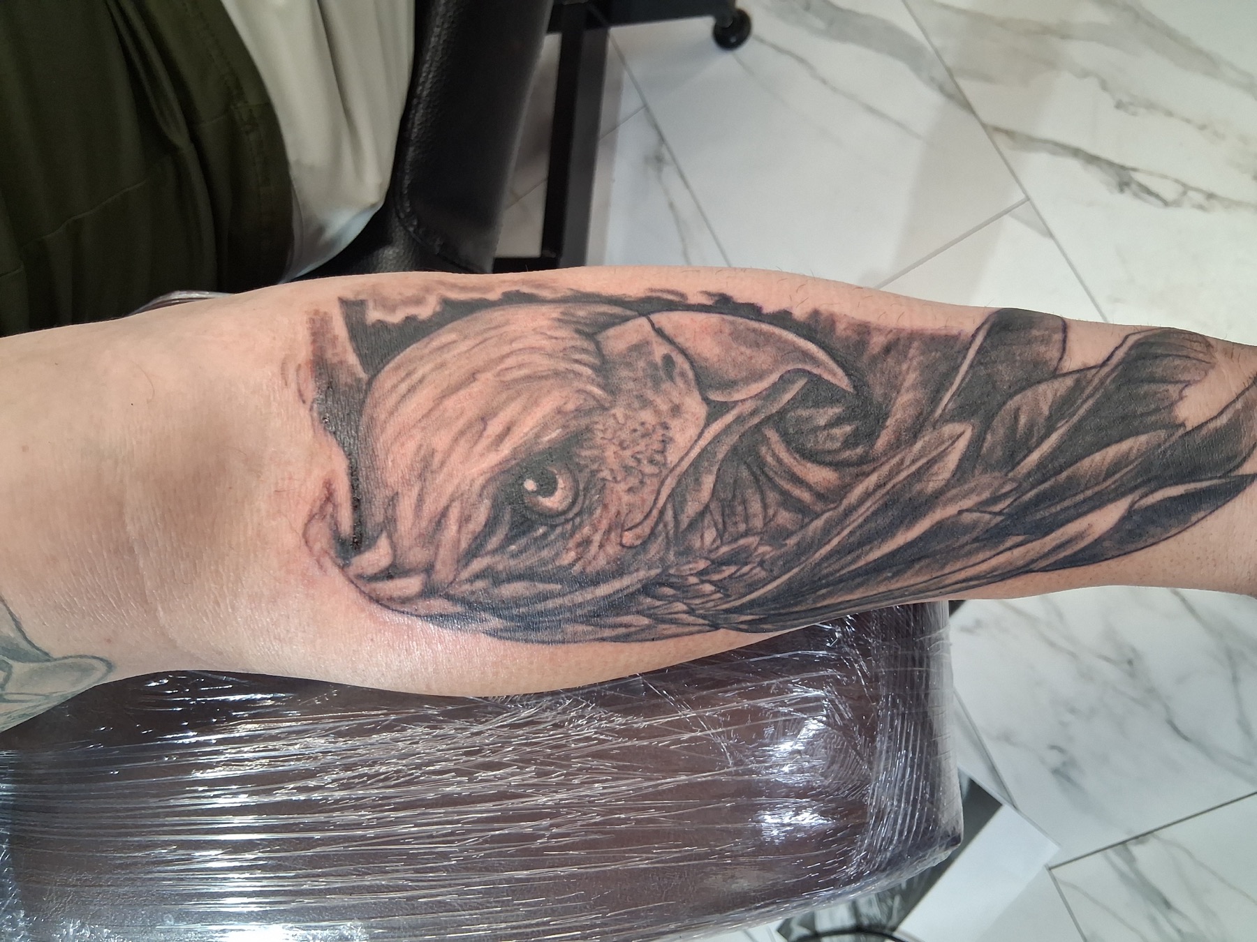 Black and gray eagle tattoo by Tony Parisi